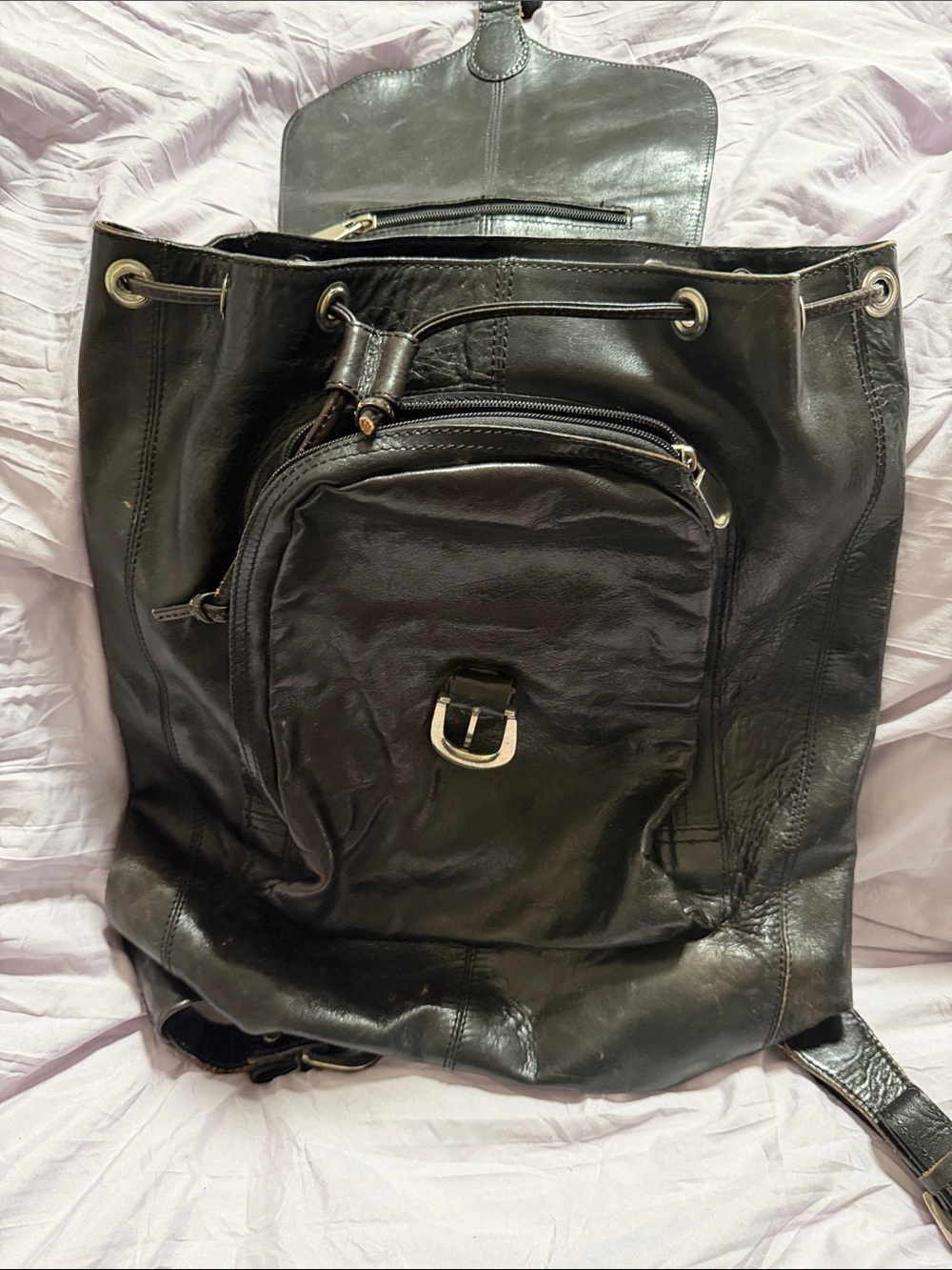 Wilsons Leather Black Drawstring Leather Backpack with Front Zip Pocket